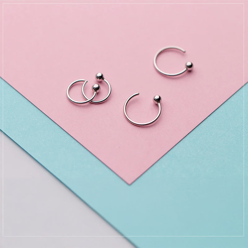 Close view of silver hoop finish showing smooth round bead styling