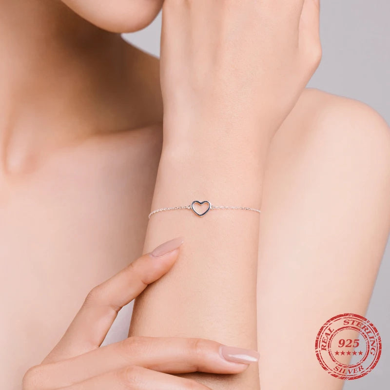 Sterling silver bracelet featuring a refined bracelet chain and subtle charm and bracelet look