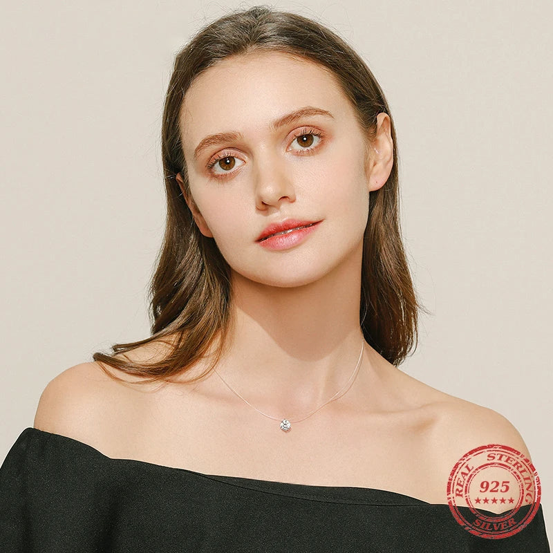 Dainty necklace in sterling silver with subtle charm necklace detail