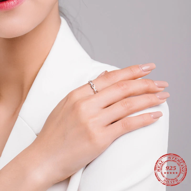 Stackable ring styled beside a sterling silver ring set