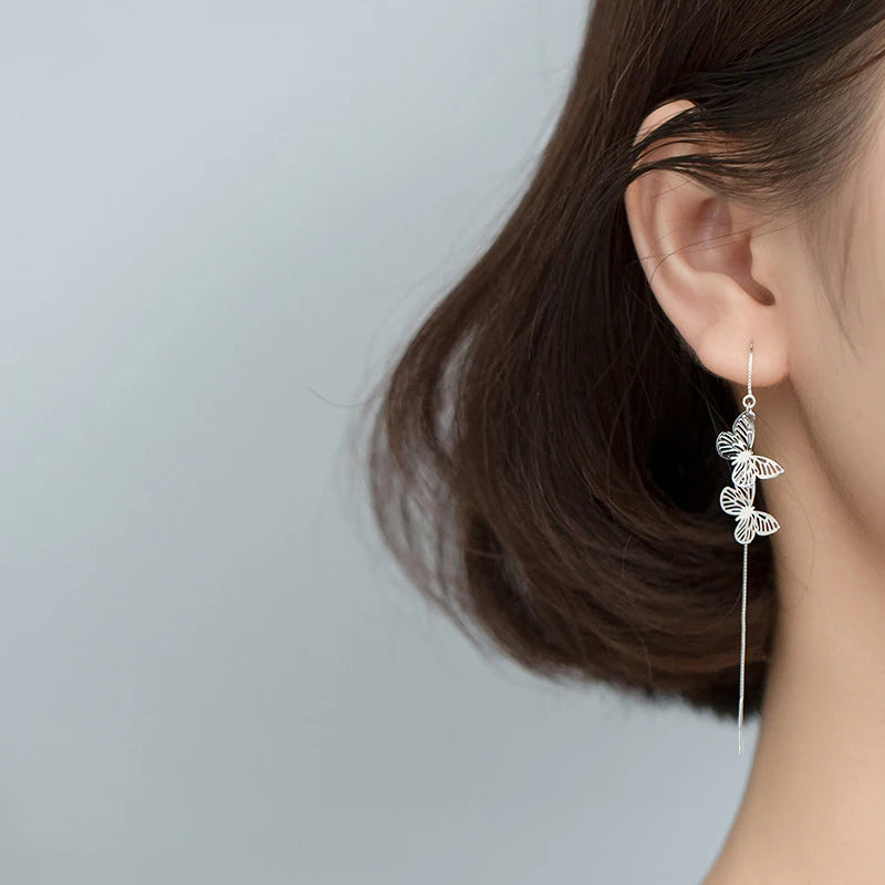 Earrings with butterfly accents crafted as elegant drop earrings