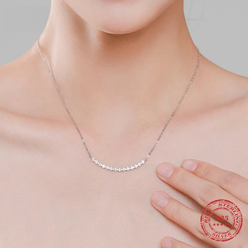 Silver womens necklace styled as a long necklace with zirconia