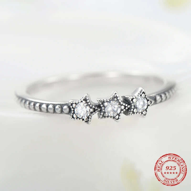 Sterling silver ring with subtle star ring accent and bright finish