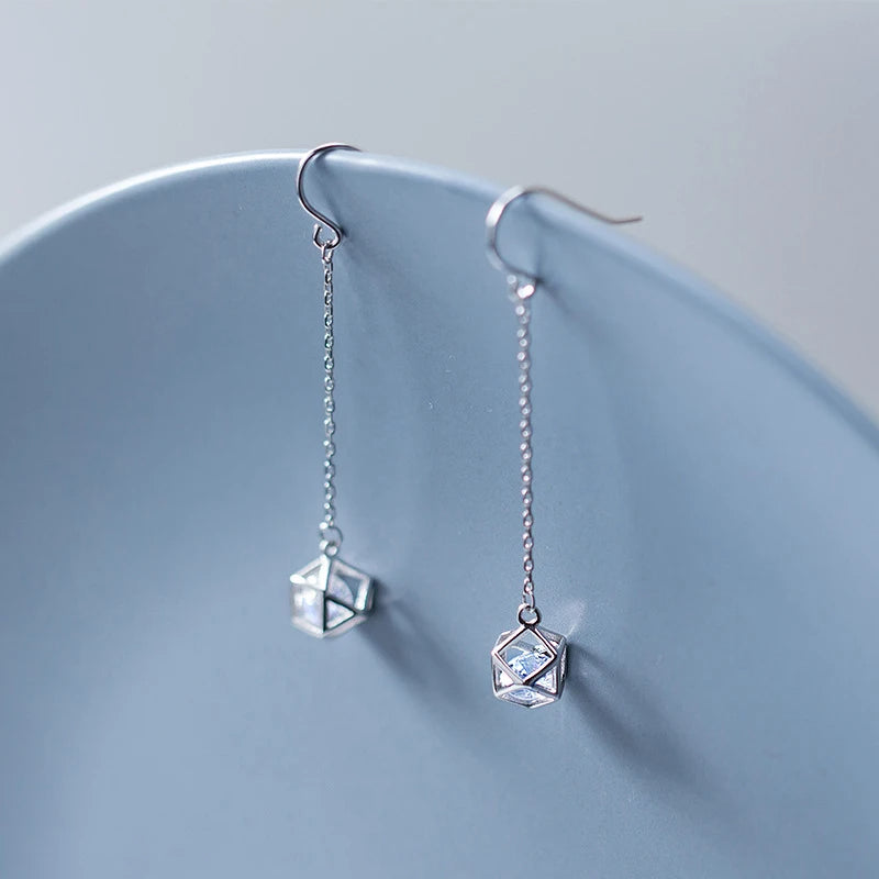 925 sterling silver drop earrings styled beside silver hoops