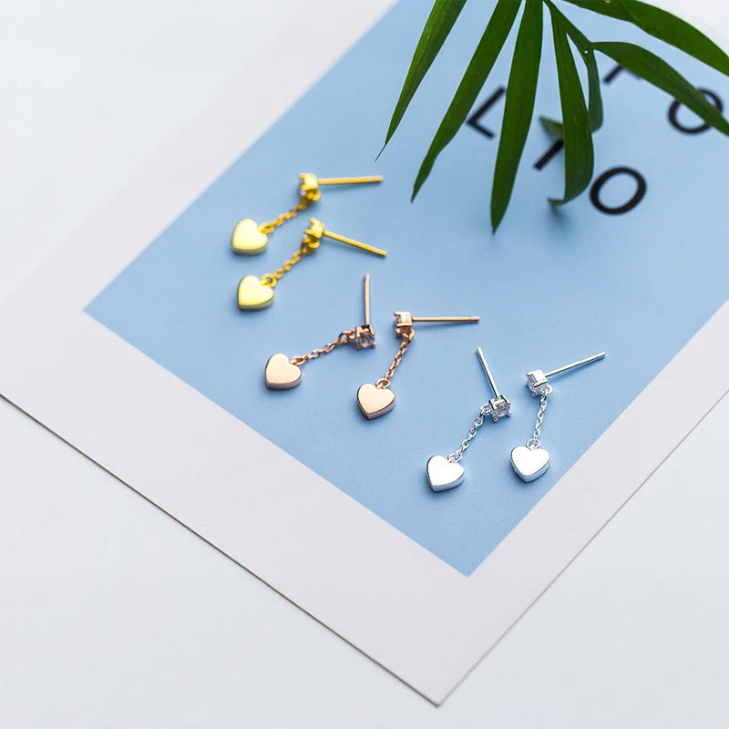 Sterling silver earrings inspired finish with silver color hearts and subtle rose gold