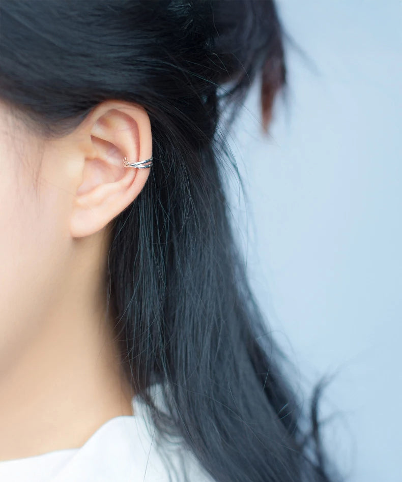 Classic charm clip-on earrings displayed on black velvet