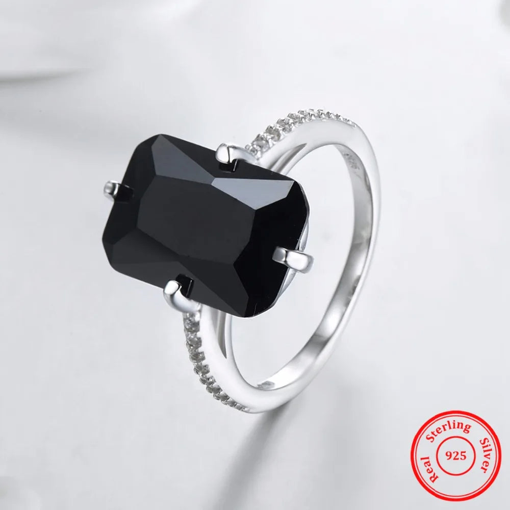 Silver ring for women featuring a radiant black crystal and crystal jewelry glow