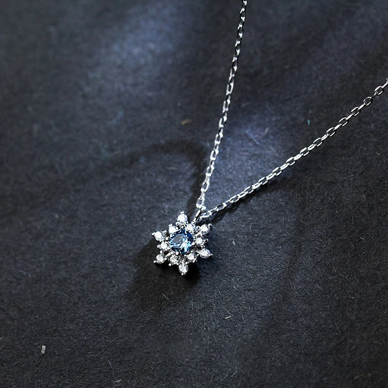 Refined sterling silver necklace featuring a cz snoowflake pendant