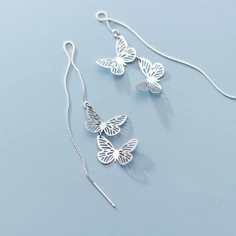 Chic drop earrings with butterfly earrings detail in silver color