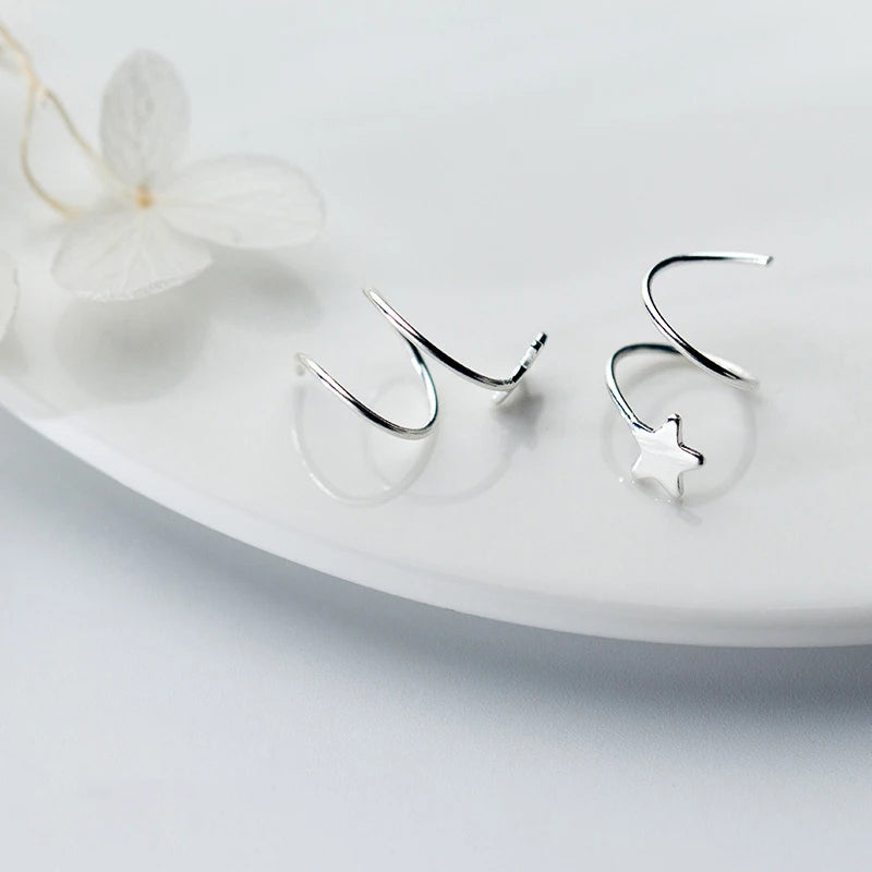 Elegant stud earrings in 925 sterling silver with rotating star accent