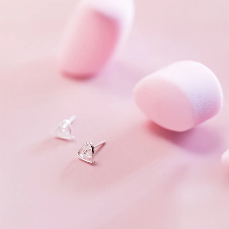 Sterling silver earrings with polished shine in a simple stud earrings look