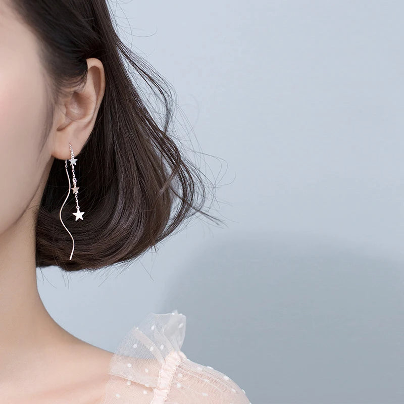 Close view of ear rings showing earrings with stars sparkle