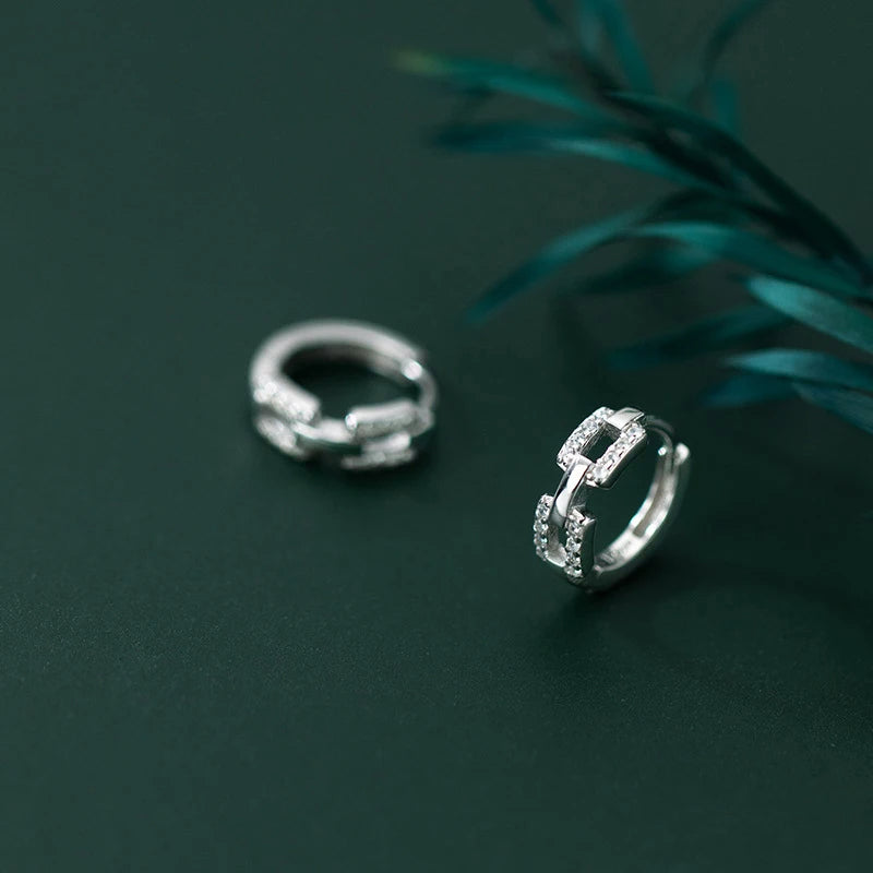 Sterling silver ear buckles set with cubic zirconia in clean lines