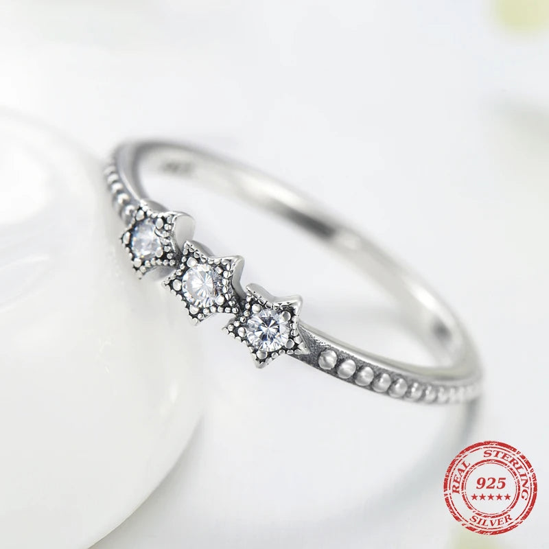 Close up sterling ring highlighting polished 925 silver surface