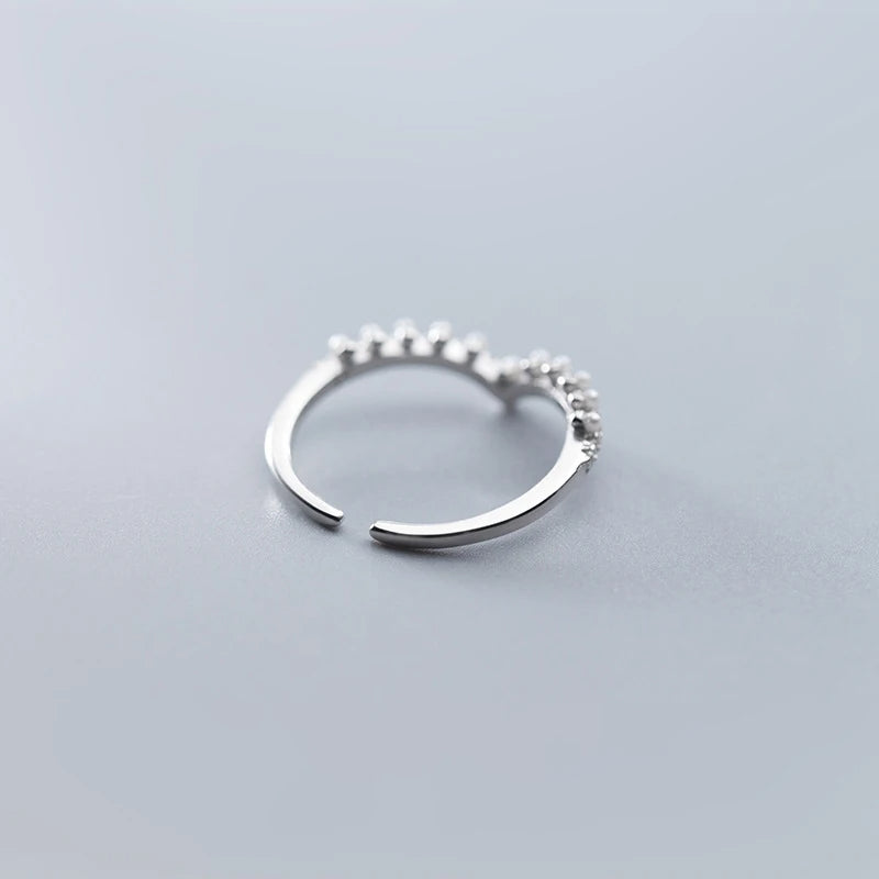 Sterling ring with ring shapes design and a pearl focus