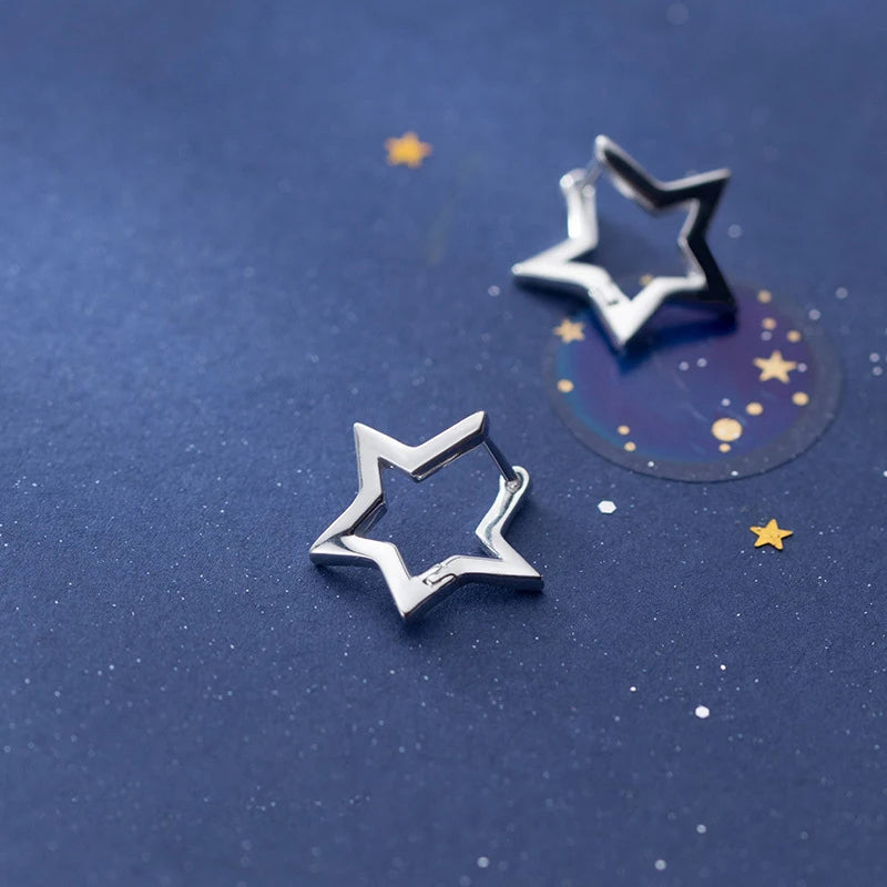 Minimal star earrings on sleek hoop earrings design
