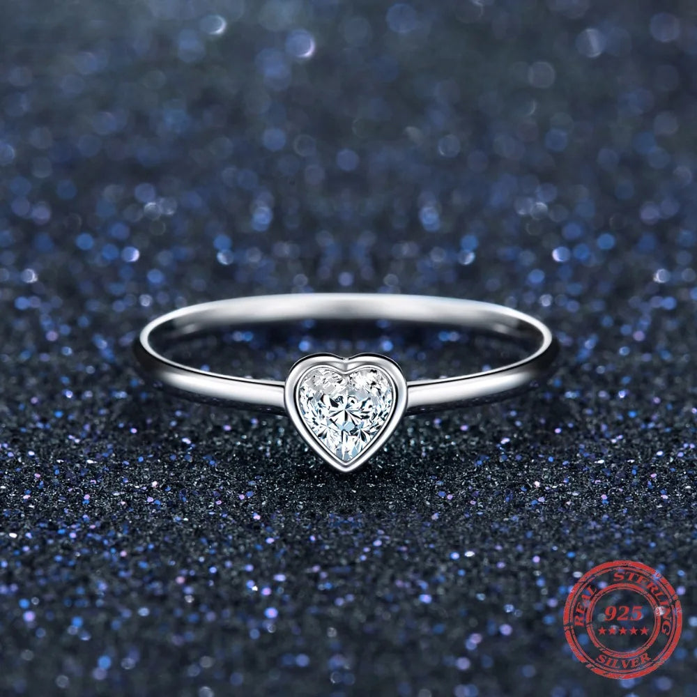 Close view of heart rings style featuring a polished heart cz center