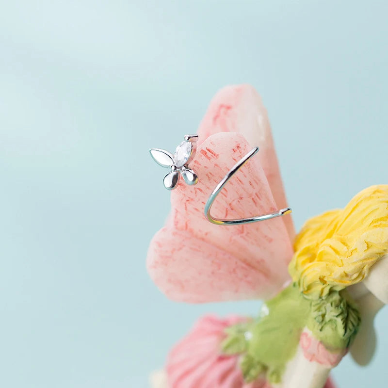 Close up of sterling silver earrings shaped as Spiral Earrings for women