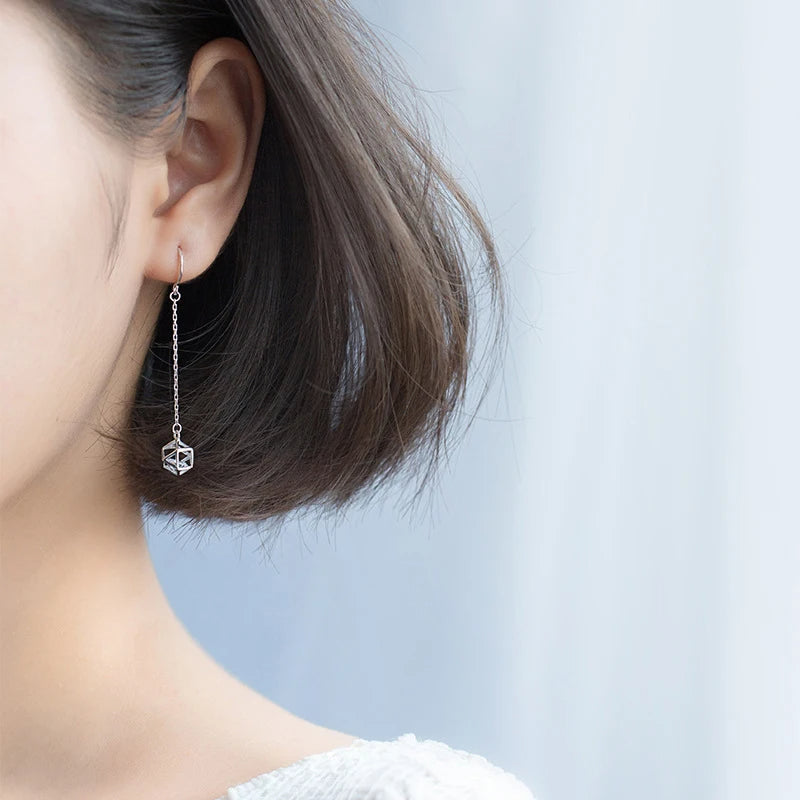 Ear rings crafted in sterling silver showing polished CZ sparkle