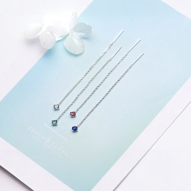 Elegant drop earrings featuring blue stone center and crystal jewelry accents