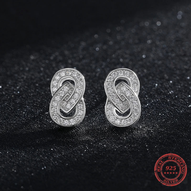 Sterling silver earrings with smooth finish and silver color glow