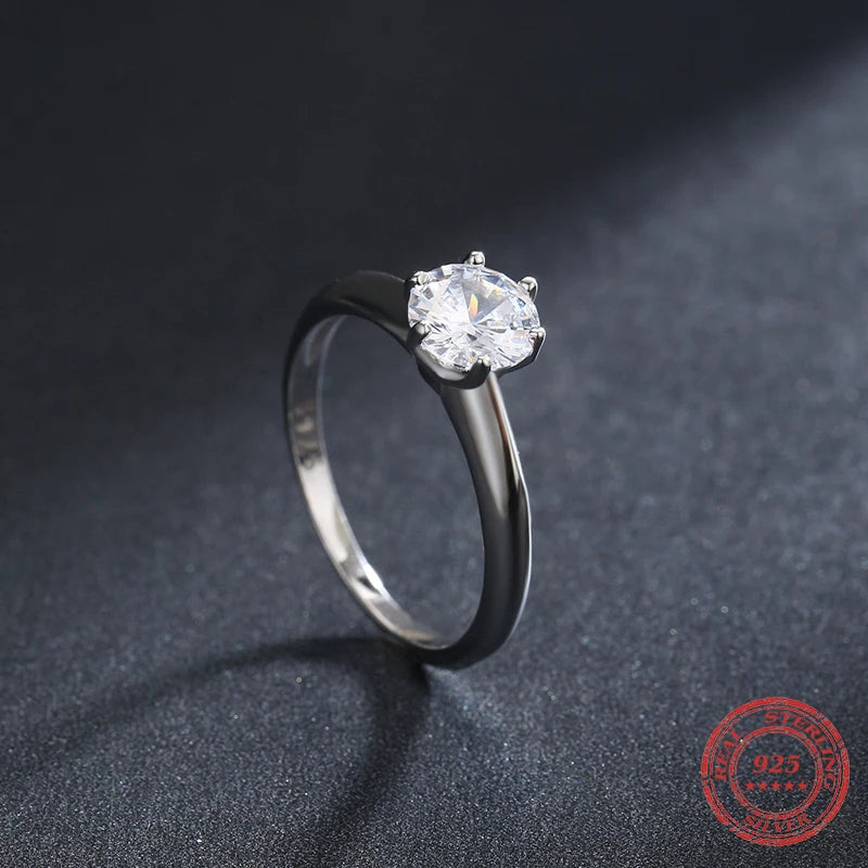 Silver ring close up with gentle curves and ring size from ring guidance