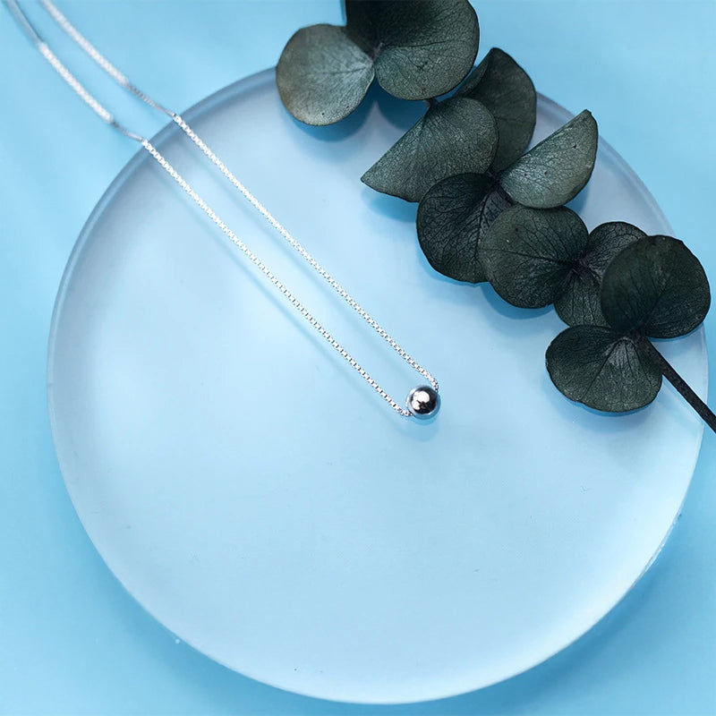 Close view of pendant necklace in 925 sterling silver with bead accent