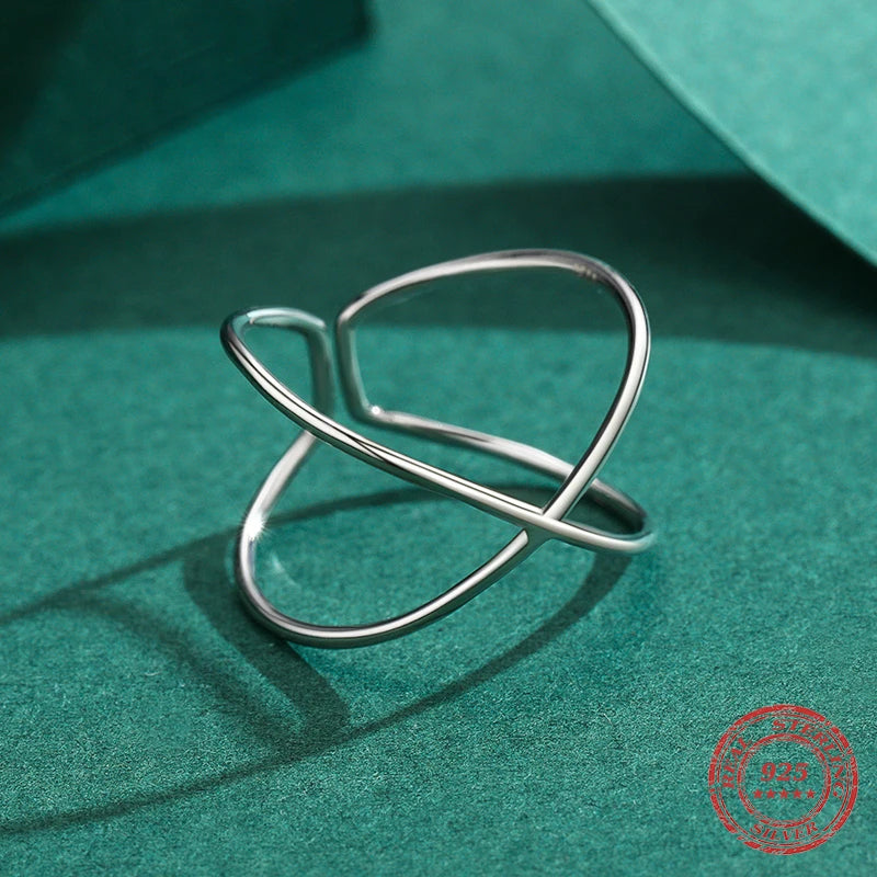 Minimal shot of ring shapes on a polished sterling silver size ring