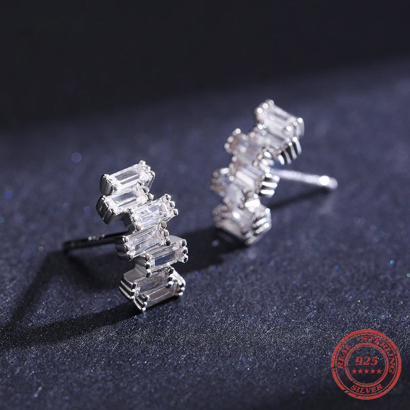 Earrings emerald style presented as elegant sterling silver earrings