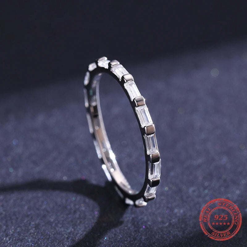 A wedding ring shown beside a coordinated wedding band ring