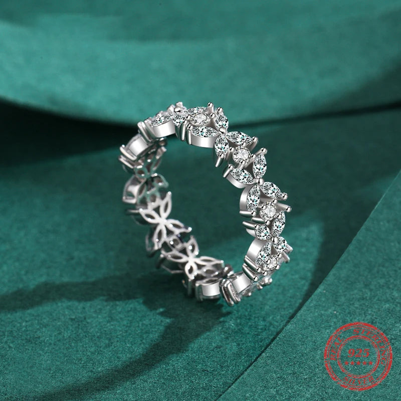 Polished 925 silver band styled as a stacking ring with CZ accents