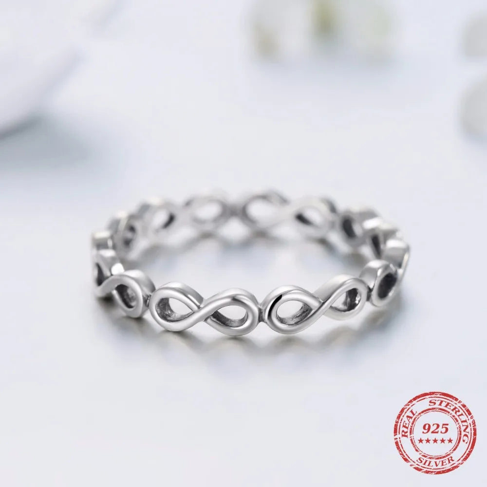 Ring and wedding band pairing in polished 925 sterling silver