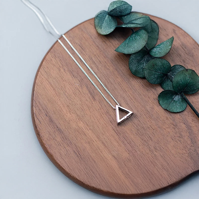 Sterling silver chain supporting a pendant necklace in silver color