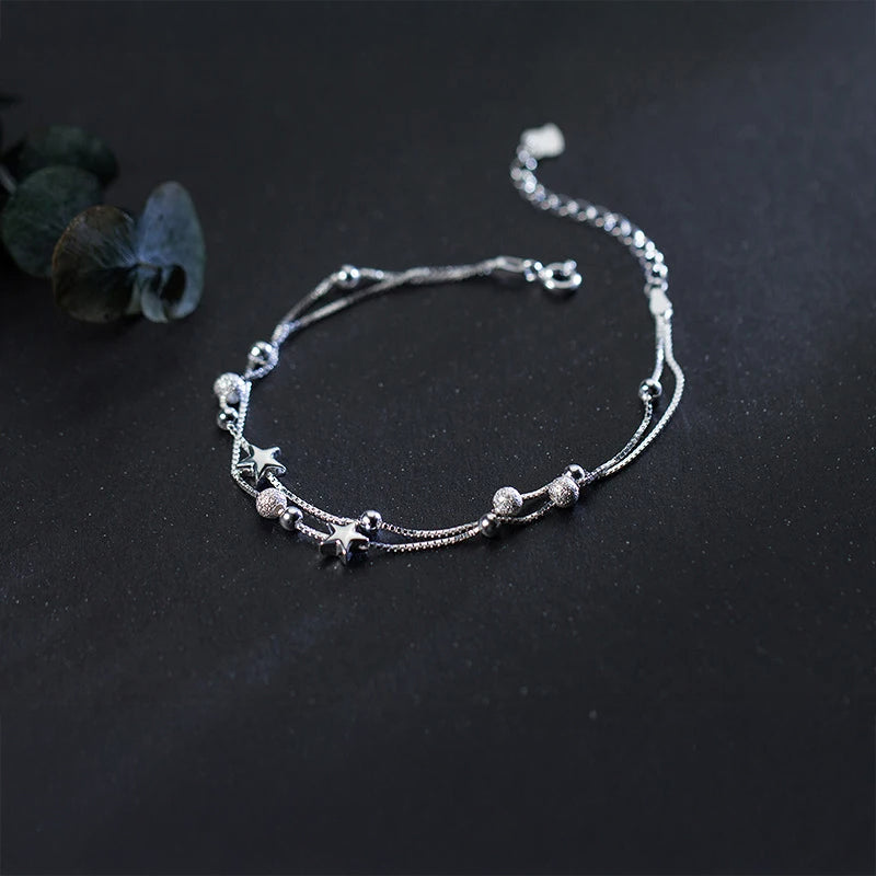 Silver bangle look on a sterling silver bracelet with bead accents