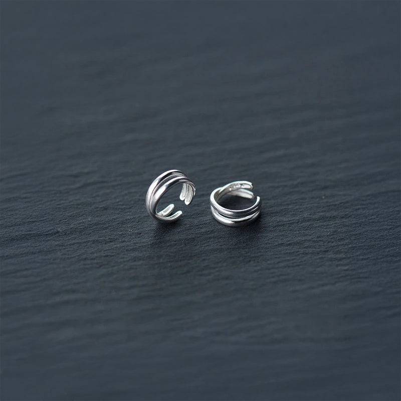 Side view of silver clip earrings that clip on comfortably