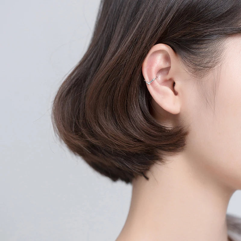 Sterling silver ear rings shown beside coordinating silver hoops