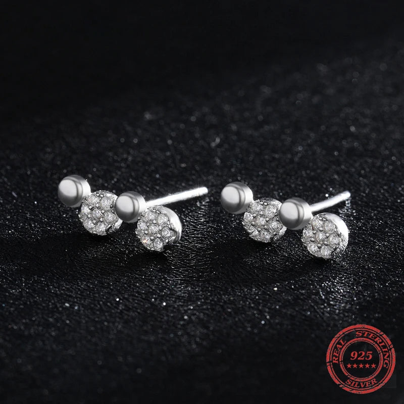 Silver earrings with clean lines and a clear cz focal point
