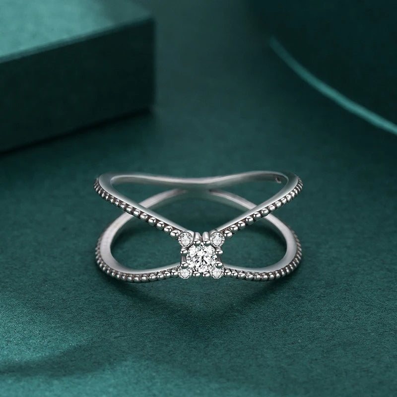 Silver ring for women in a geometric crossover ring style