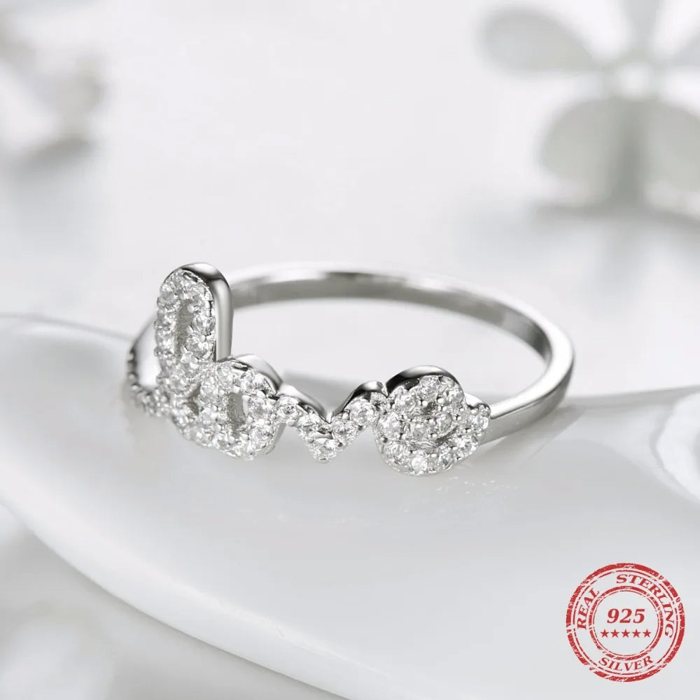Sparkling CZ anniversary ring with sterling silver band