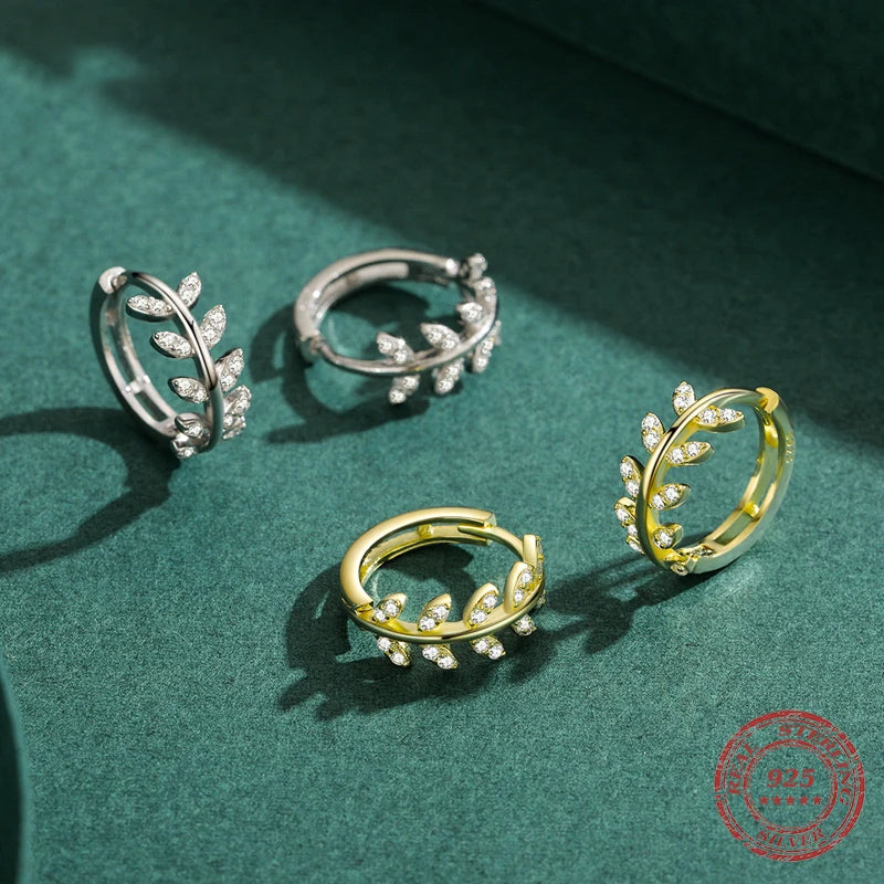 Sterling silver hoop earrings styled with crystal jewelry accents