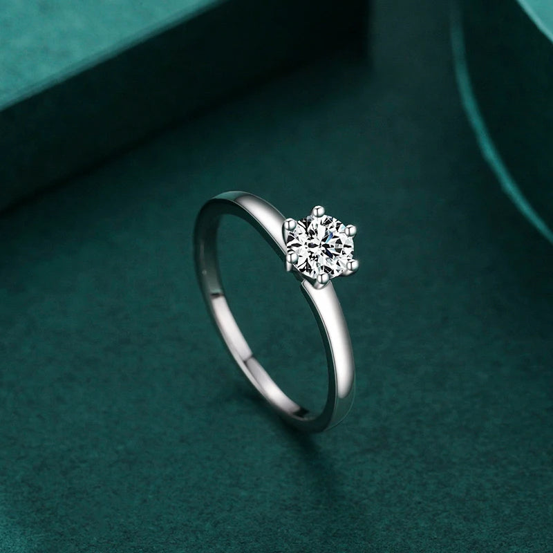 Slim 925 sterling silver wedding band paired with cz rings