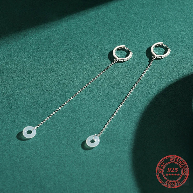 Hoop on hoop earrings layered with silver hoop accents