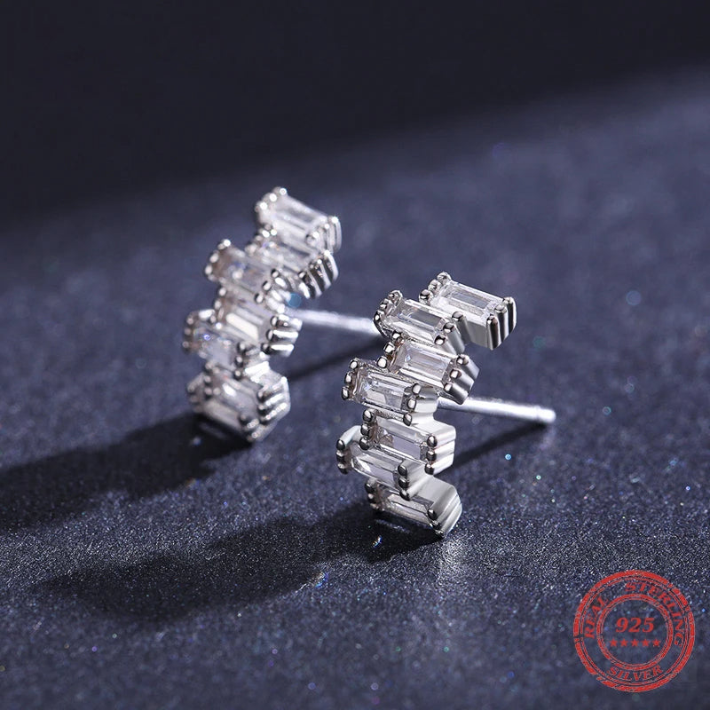 Emerald jewelry studs set in a polished 925 sterling silver finish