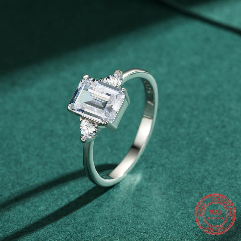 Close up sterling ring with emerald cut ring design and bright CZ