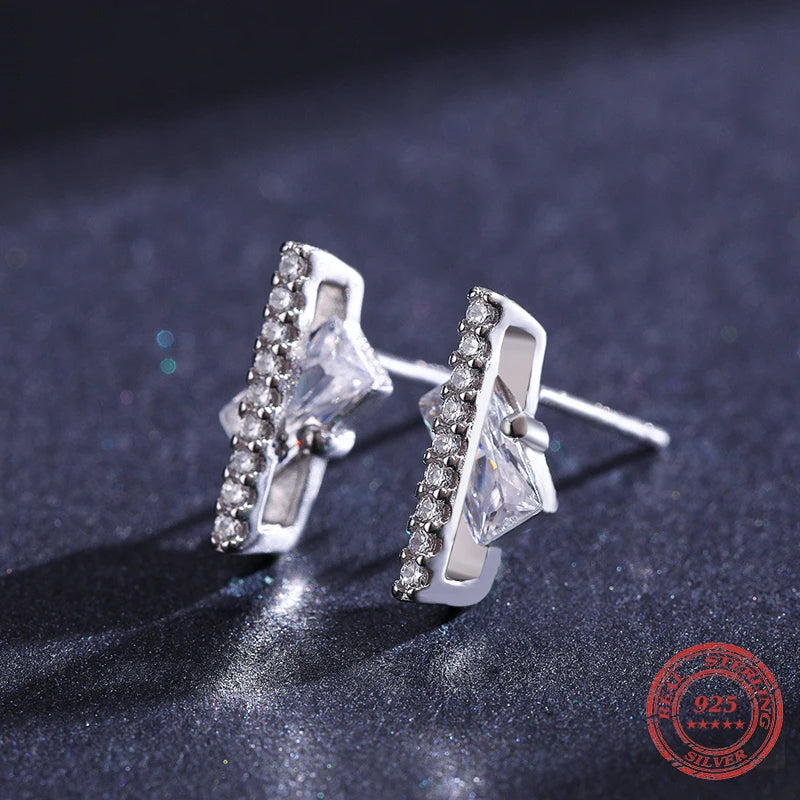 Polished silver color cz earrings styled for daily wear