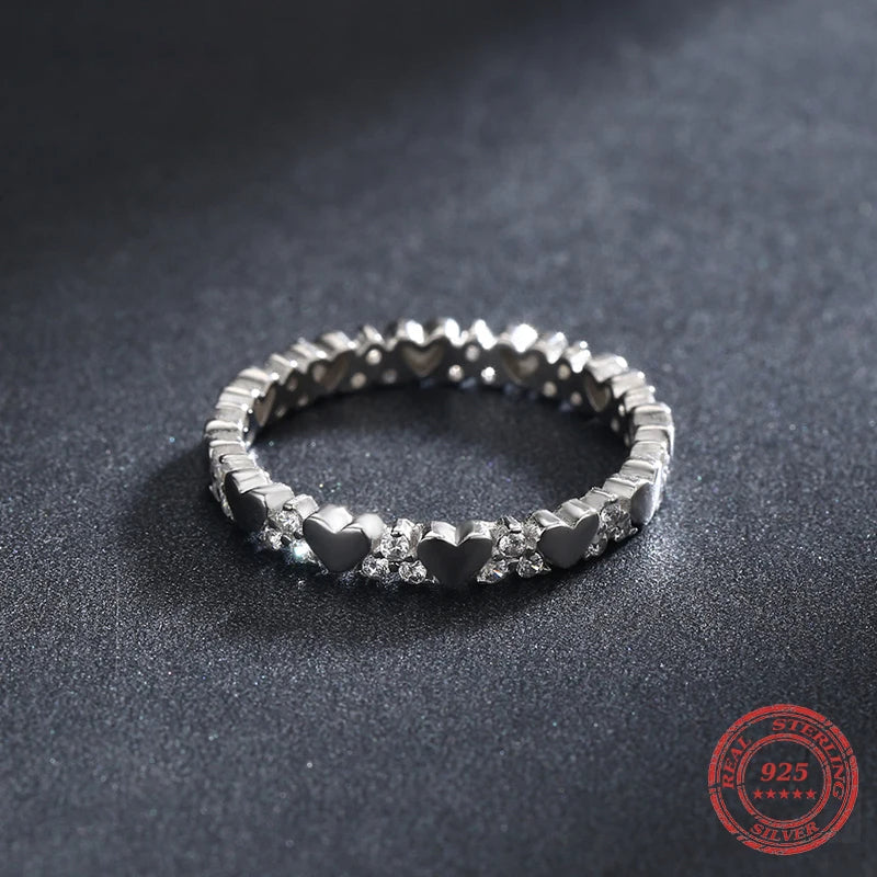 Delicate stackable rings featuring a tiny heart motif
