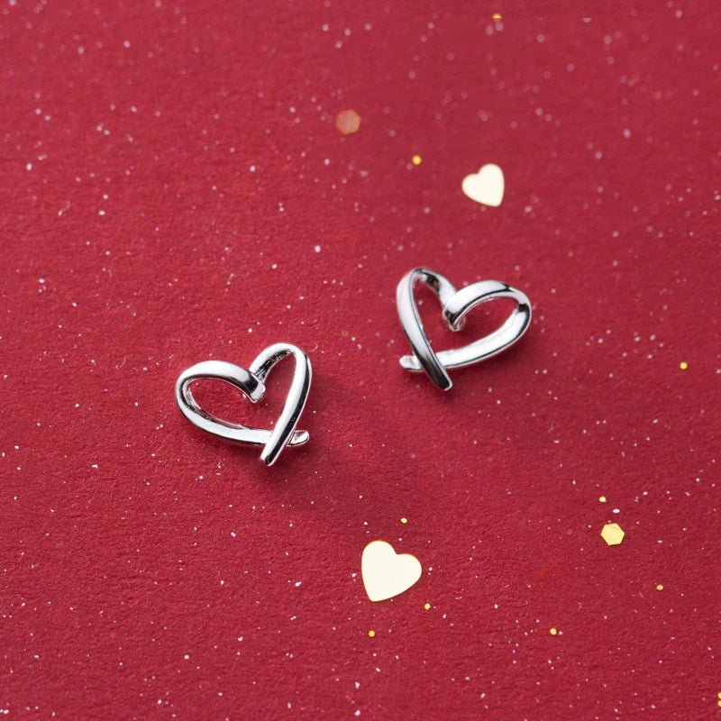 Heart earrings in 925 sterling silver as classic silver stud earrings
