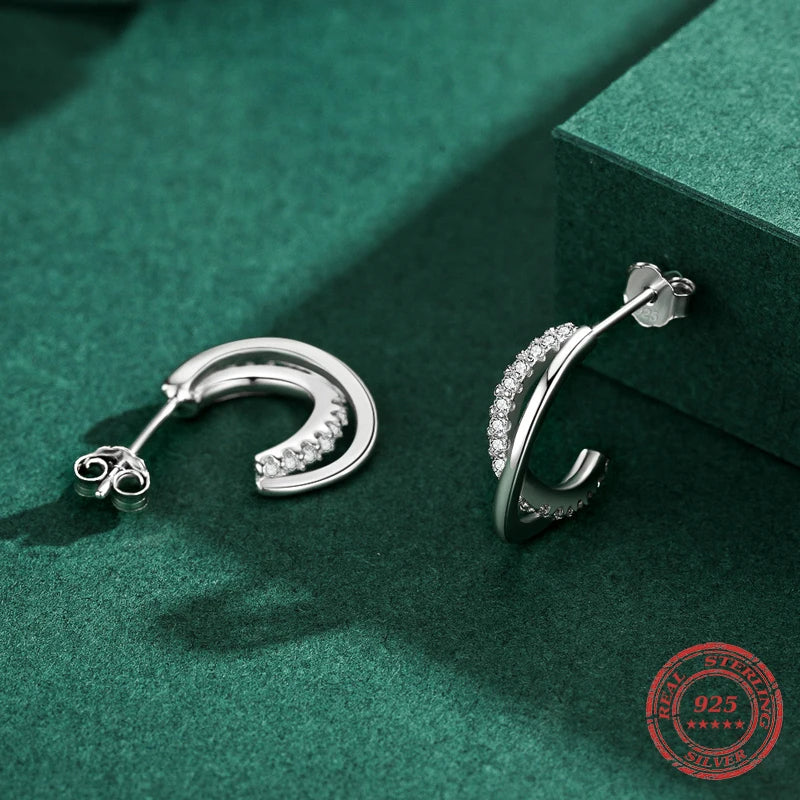 Geometric silver stud earrings with clear cubic zirconia stones