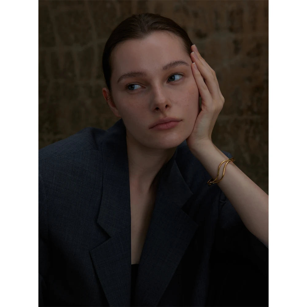 Gold plated cuff bracelet showcasing double layer elegance