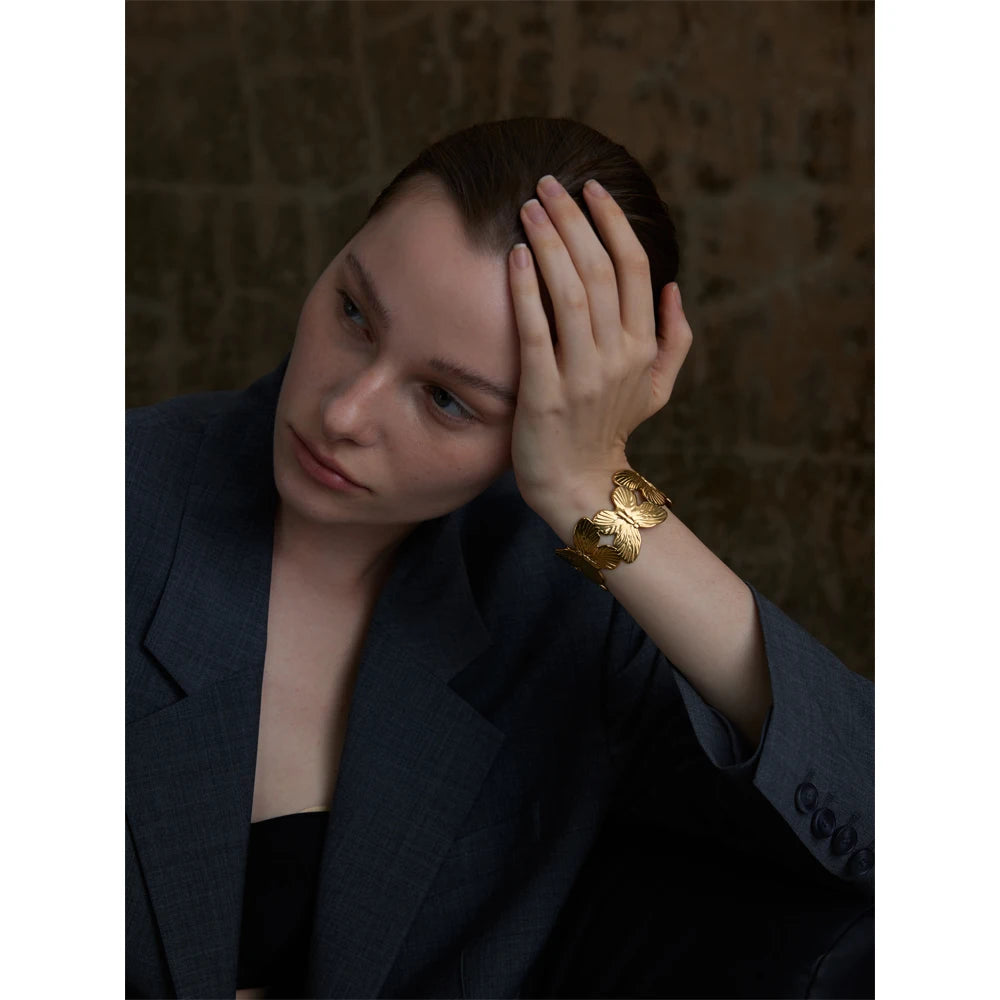 Statement wide cuff with butterfly motif in steel metal